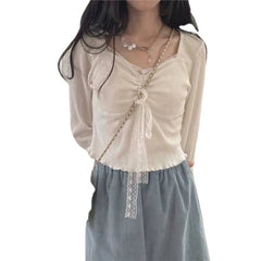 A Woman Wearing A Sweater With A Base Top